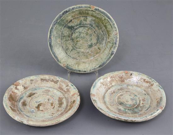 A set of three Chinese green glaze pottery dishes, Han dynasty, diameter 14cm